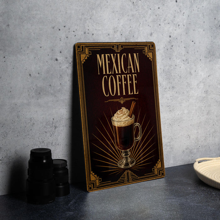 A decorative sign for "Mexican Coffee" featuring an illustration of a coffee drink with whipped cream and cinnamon sticks.