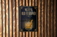 A sign for "Mezcal Old Fashioned" is displayed on a wooden wall.
