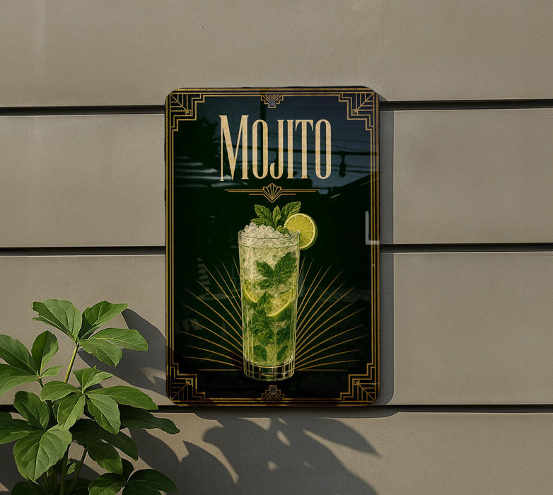 A framed advertisement for a mojito cocktail is displayed on a wall, featuring a glass of the refreshing drink with a lime wedge.