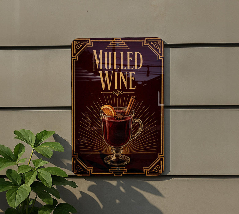 A sign on a wall advertising "Mulled Wine", featuring an illustration of a glass of wine with a slice of orange and a cinnamon stick.