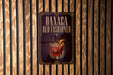 a sign for "Oaxaca Old Fashioned", which is displayed on a wooden wall.
