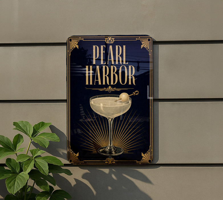 A sign for "Pearl Harbor" hanging on a wall, featuring an illustration of a cocktail glass with a cherry on top.