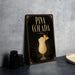 A framed poster advertising a Pina Colada cocktail, featuring an illustration of a Pina Colada drink on a black background with gold accents.