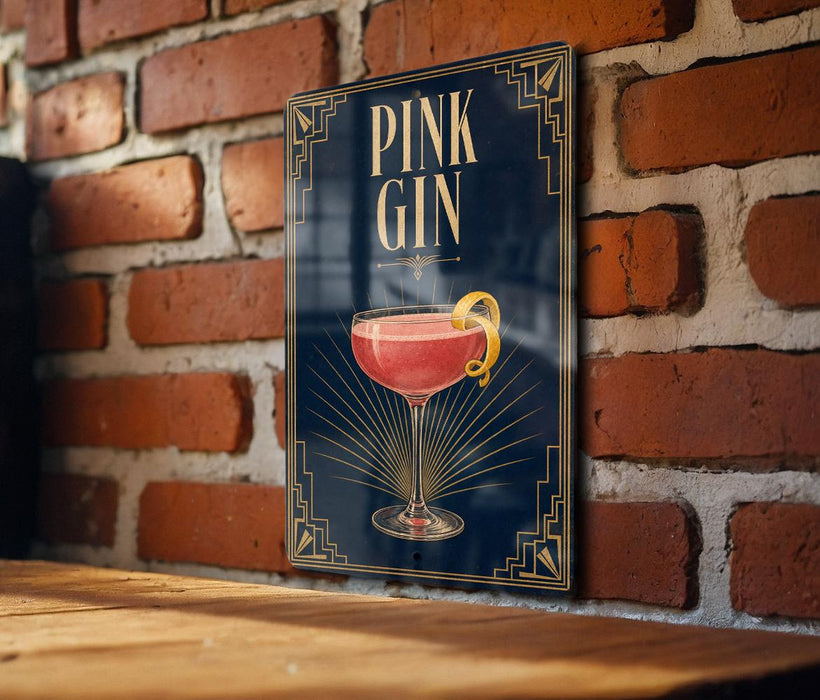 A sign with the text "PINK GIN" and an illustration of a pink gin cocktail is displayed on a brick wall.