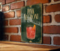 A sign for "PINK NEGRONI" is displayed on a brick wall, featuring an illustration of a pink cocktail with an orange slice.