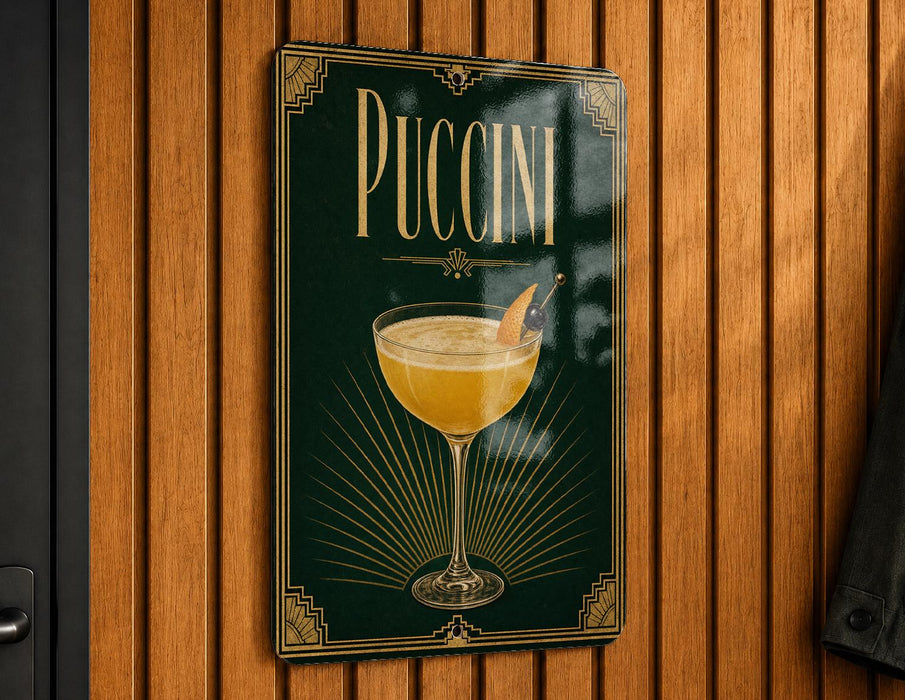 A sign for "PUCCINI" hanging on a wooden wall, featuring an illustration of a glass of Puccini cocktail.