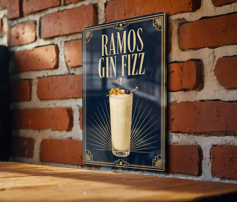 A poster advertising "RAMOS GIN FIZZ" is displayed on a brick wall, featuring a glass of the cocktail with a garnish on top.