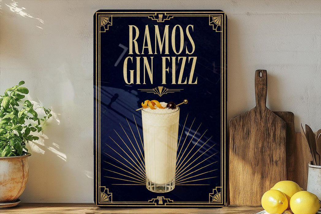 a poster advertising a drink called "RAMOS GIN FIZZ" with a glass of the drink and garnish on a wooden surface.