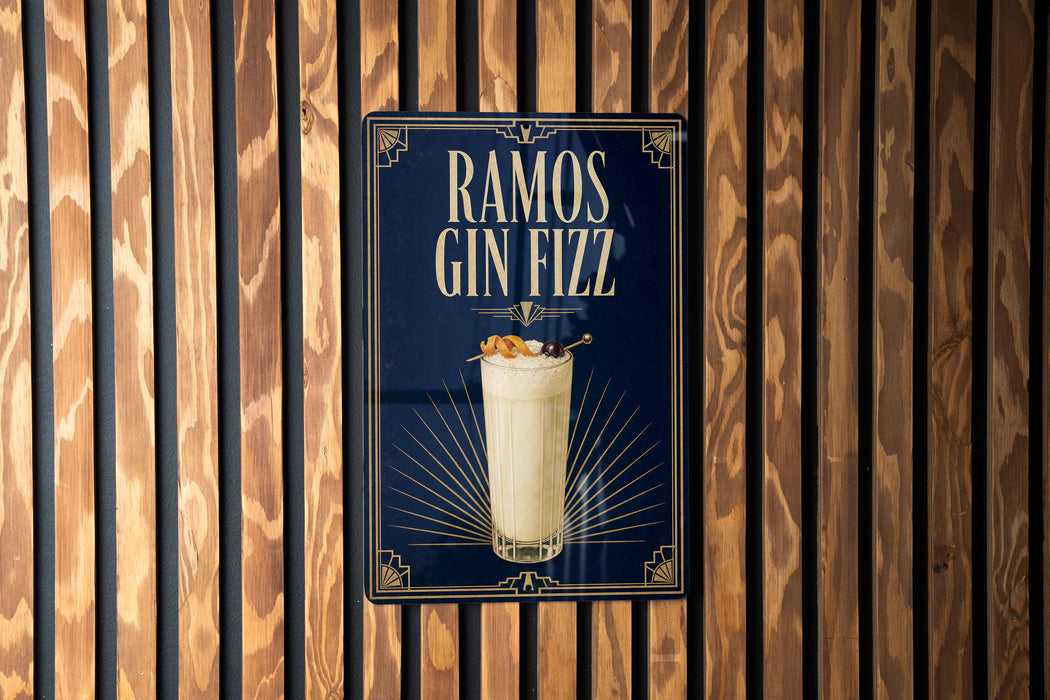 A poster advertising "RAMOS GIN FIZZ" is displayed on a wooden wall.