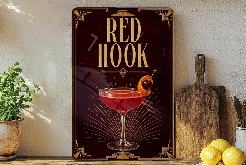 a decorative sign with the text "RED HOOK" and an illustration of a cocktail glass with a cherry and an orange slice.