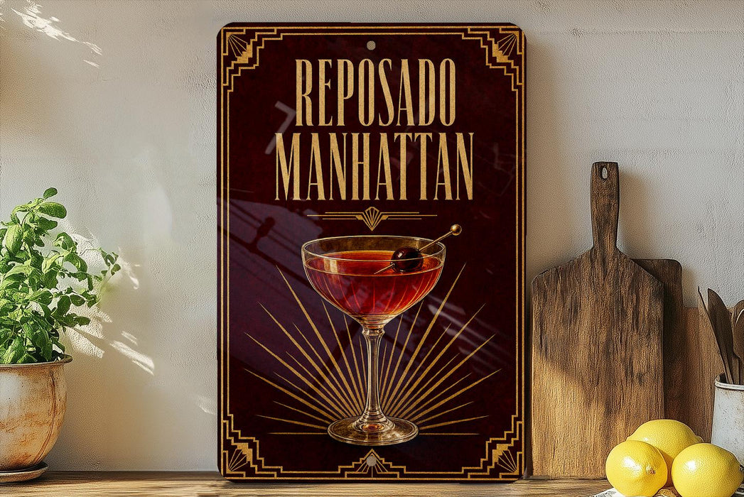 a sign for "Reposado Manhattan", which is a cocktail, placed on a wooden surface next to a cutting board and some lemons.