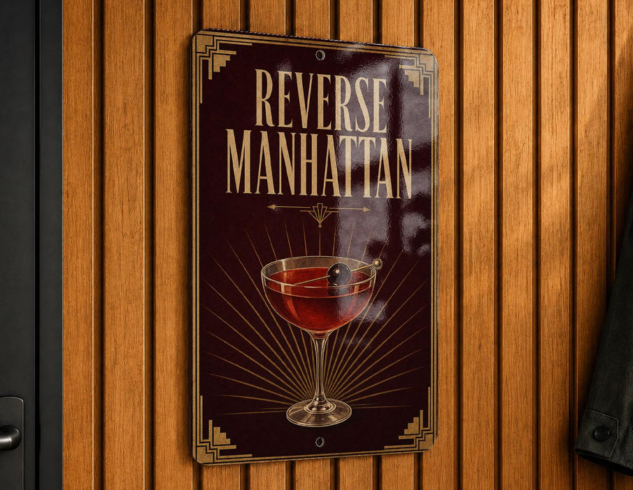 A sign that reads "Reverse Manhattan" is hanging on a wooden wall.