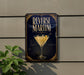 a sign for "Reverse Martini" with a martini glass and lemon on a wall.