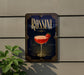 A decorative sign for "Rossini" cocktail, featuring a glass of red cocktail with a strawberry garnish, mounted on a wall.