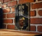 A framed poster with the text "RUM AND COKE" and an illustration of a glass of rum with a lime slice.