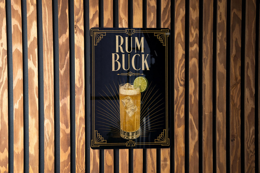 A sign for "RUM BUCK" cocktail is displayed on a wooden wall.