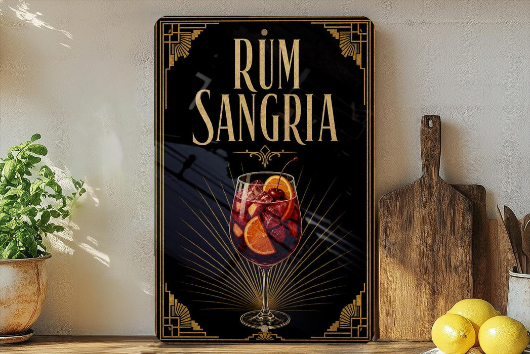 a decorative sign for "RUM SANGRIA" with a glass of wine and citrus slices, placed on a wooden surface next to a potted plant and a cutting board.