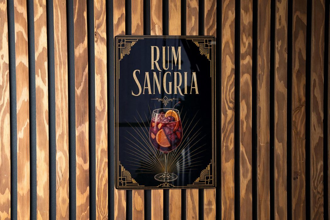 a poster advertising rum and Sangria, with a glass of the drink prominently displayed.