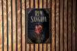 a poster advertising rum and Sangria, with a glass of the drink prominently displayed.