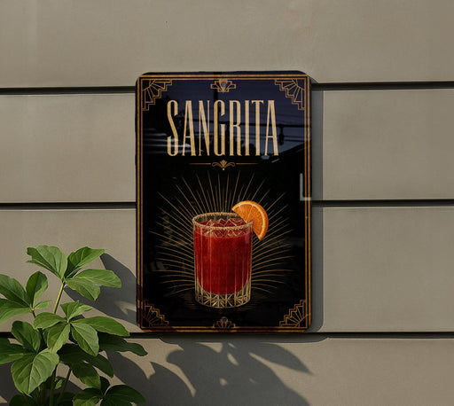 A decorative sign for a Sangrita cocktail, featuring an illustration of a glass filled with a red drink and an orange slice.
