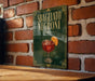 A sign with the text "SBAGLIATO NEGRONI" and an illustration of a glass of Negroni, a famous Italian cocktail, is displayed on a brick wall.