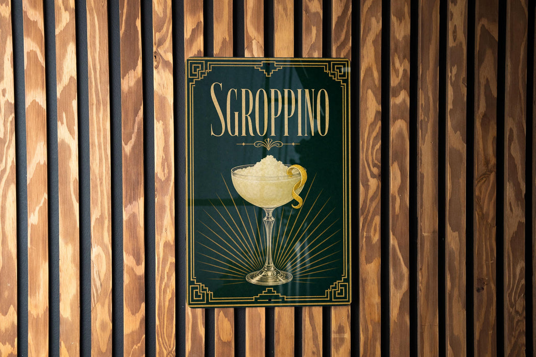 A poster with the word "SGROPPINO" and an illustration of a cocktail glass is displayed on a wooden wall.