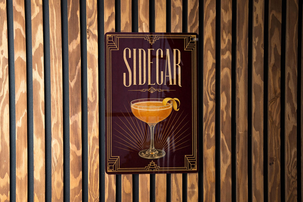 A sign for "Sidecar" cocktail is displayed on a wooden wall.