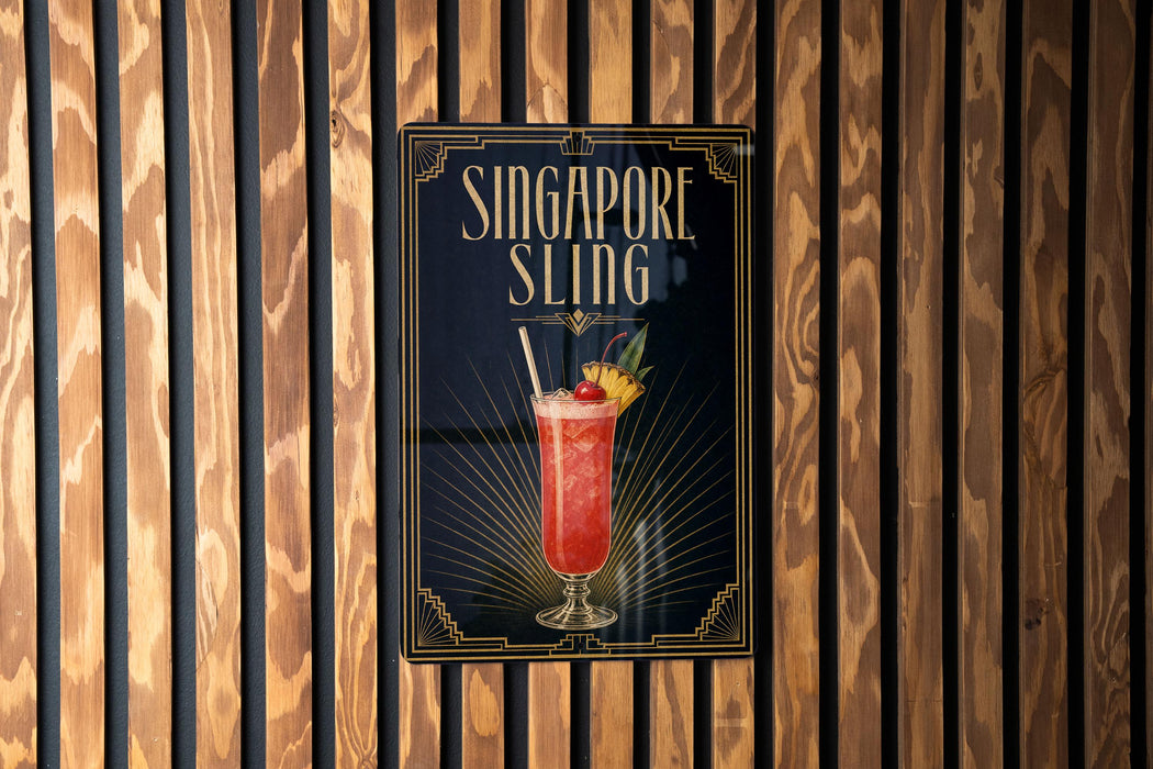 A poster advertising a Singapore Sling cocktail is displayed on a wooden wall.
