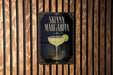 A sign for a "Skinny Margarita" cocktail is displayed on a wooden wall.