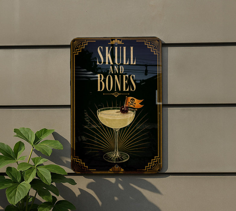 a sign with the text "SKULL AND BONES" and an illustration of a cocktail glass with a skull and crossbones symbol on it.