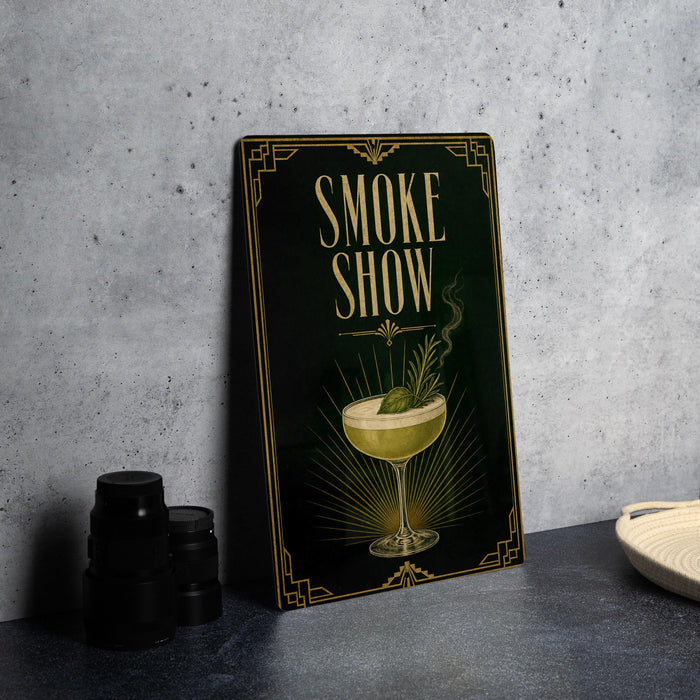 a framed poster with the text "Smoke Show" and an illustration of a cocktail glass with a garnish.