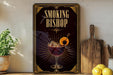 a decorative sign for a bar called "Smoking Bishop", with a glass of wine and a lemon on the sign.