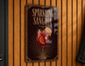 A sign for "Sparkling Sangria" is displayed on a wooden wall, featuring an illustration of a glass filled with a red drink and garnished with orange slices.