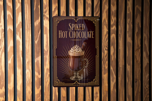 A sign for "Spiked Hot Chocolate" is displayed on a wooden wall.