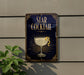 a decorative sign for a "Star Cocktail" with a glass illustration and a lemon twist, mounted on a wall.
