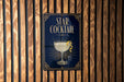 a poster advertising a "Star Cocktail" with a glass illustration and a lemon twist.