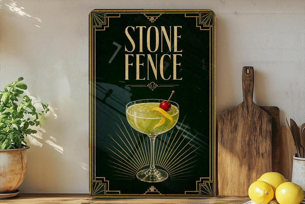 a framed poster of a cocktail glass with a garnish, placed on a shelf next to a wooden cutting board and a potted plant.