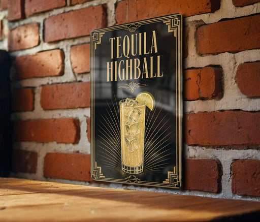 A sign for "Tequila Highball" is displayed on a brick wall, featuring an illustration of a tequila highball cocktail with a lime slice.