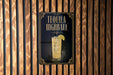 A sign for "Tequila Highball" is displayed on a wooden wall.