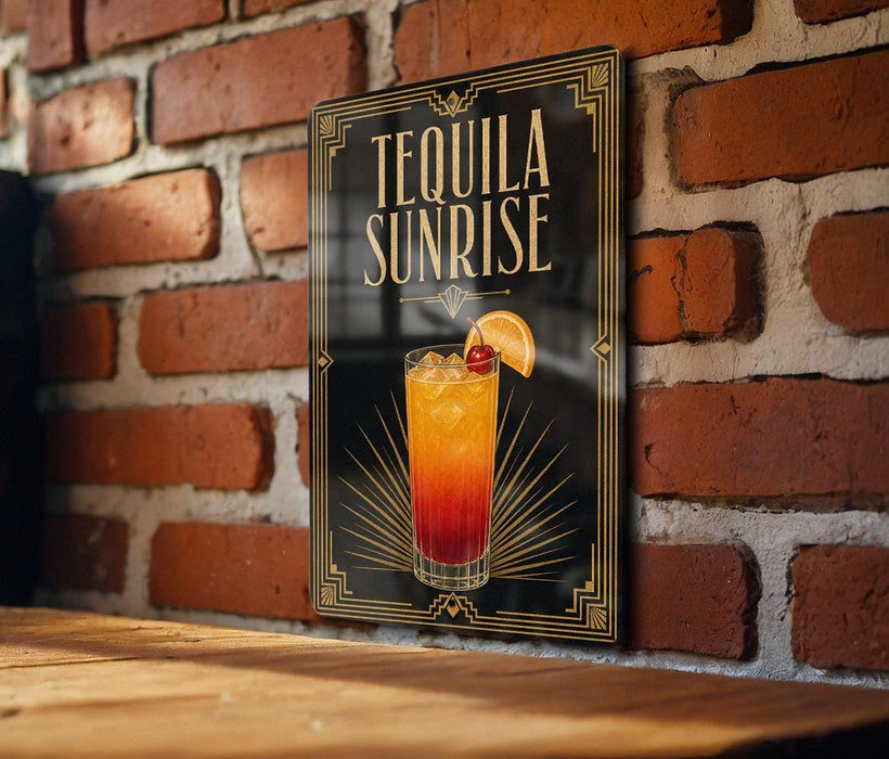 A sign for "Tequila Sunrise" is displayed on a brick wall, featuring an illustration of a colorful tequila sunrise cocktail.