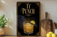 A decorative sign with the text "T'PUNCH" and an illustration of a cocktail glass with ice and a lime wedge.