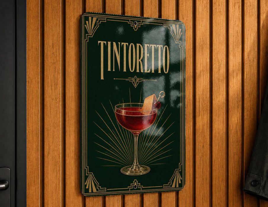 A sign for "Tintoretto" cocktail hanging on a wooden wall.