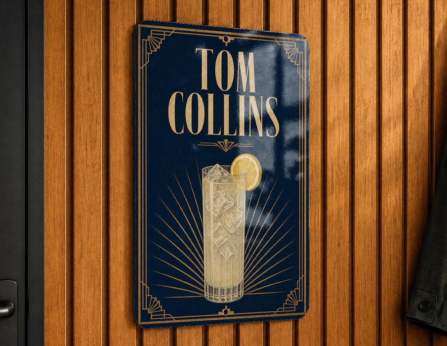 A sign for Tom Collins cocktail hangs on a wooden wall.