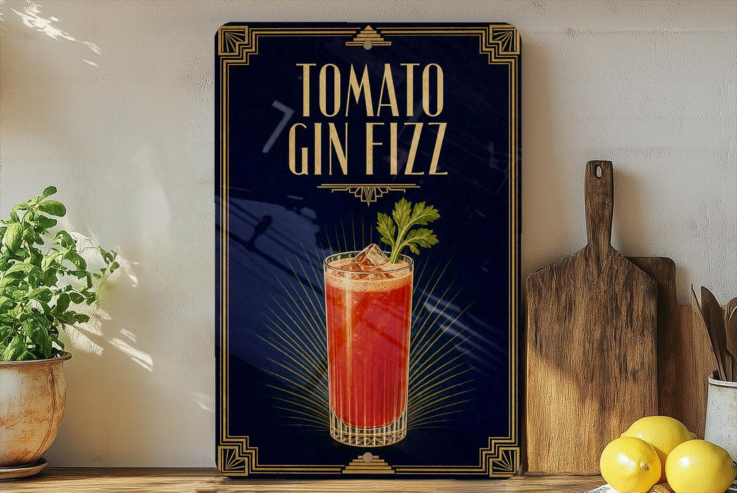 A framed advertisement for a tomato gin fizz cocktail, featuring a glass of the drink with a garnish and a wooden cutting board on a kitchen counter.