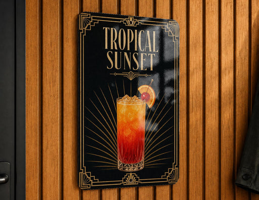 A sign for a tropical sunset cocktail, featuring a glass illustration of a colorful drink with a slice of orange on the rim.