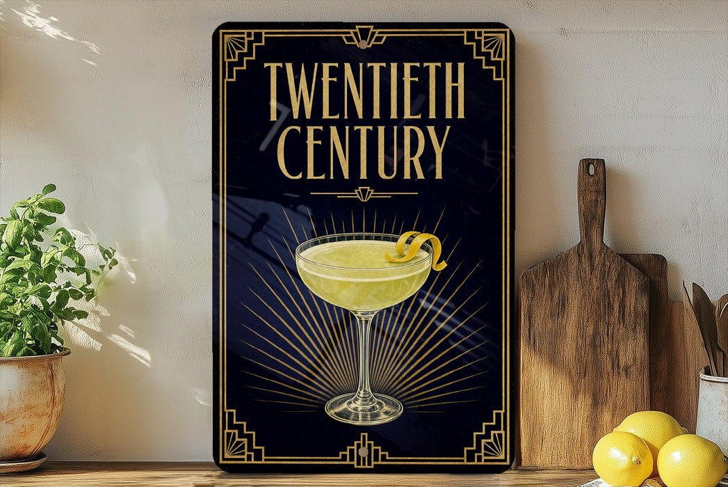 A framed poster with a yellow cocktail in a glass, surrounded by decorative elements, is displayed on a wall next to a wooden cutting board and a potted plant.