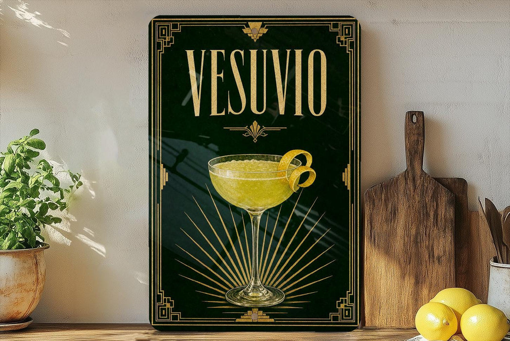a framed poster of a cocktail glass with a lemon twist, placed on a shelf next to a wooden cutting board and a potted plant.