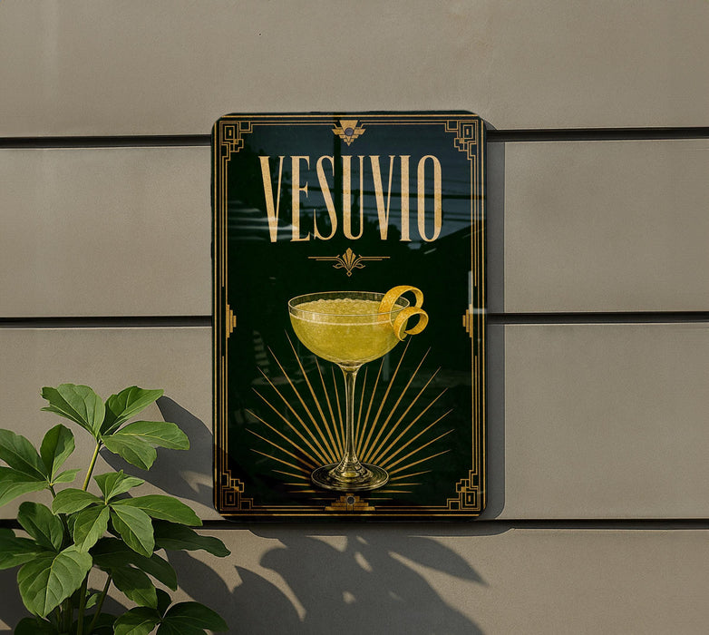 a decorative sign with the word "VESUVO" prominently displayed, along with an illustration of a cocktail glass and a lemon twist.