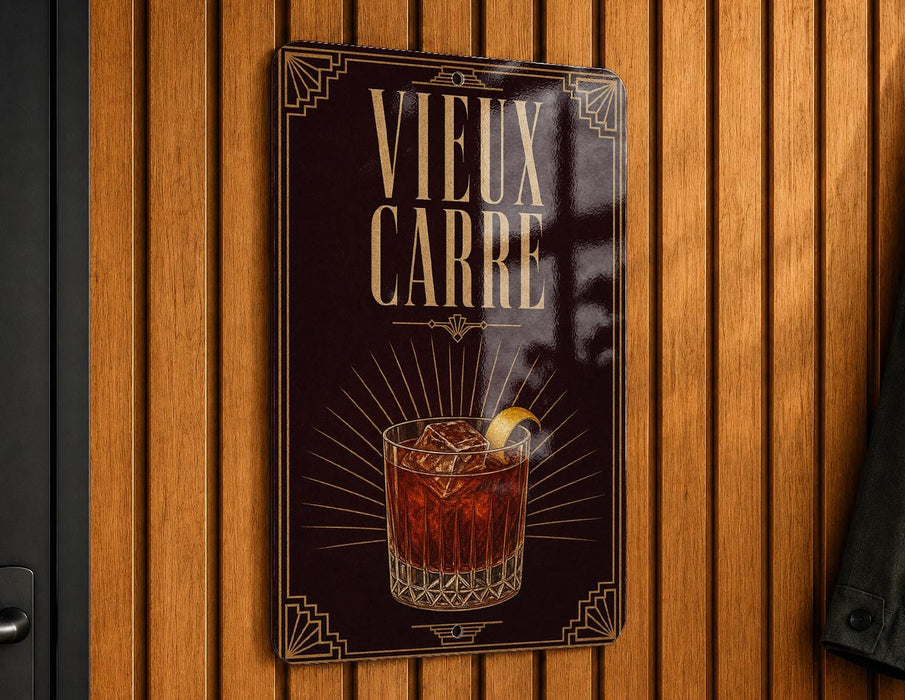 A sign with the text "VIEUX CARRE" and an illustration of a cocktail.