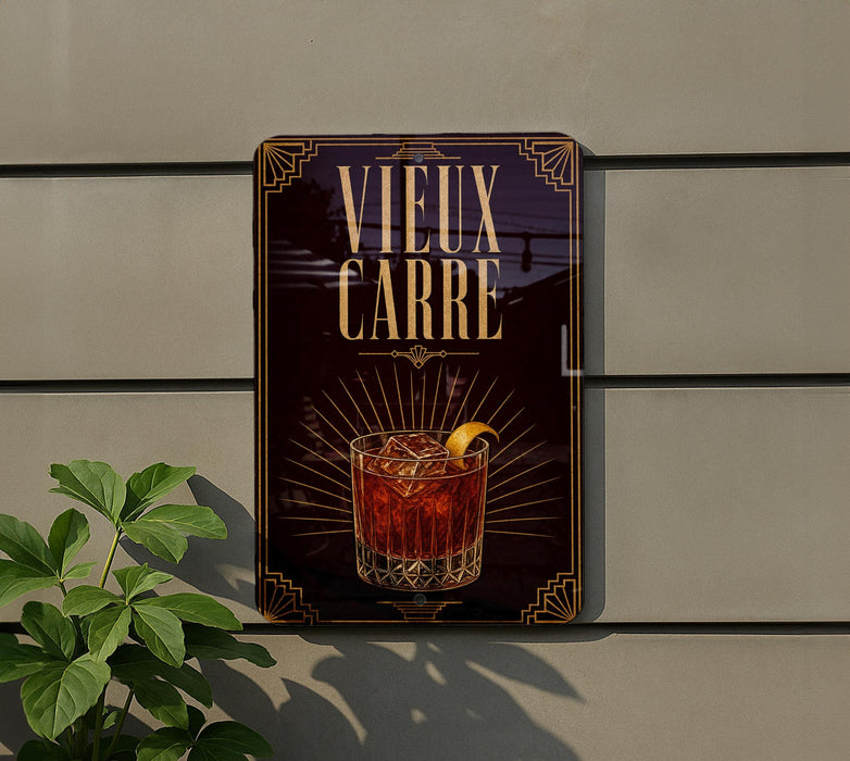 a sign with the text "VIEWUX CARRE" and an illustration of a cocktail glass with ice cubes.